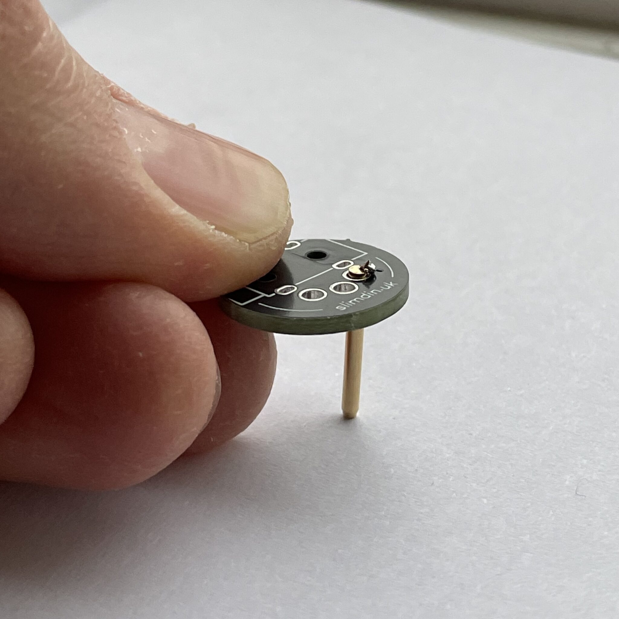 Seating the pin on a heatproof surface