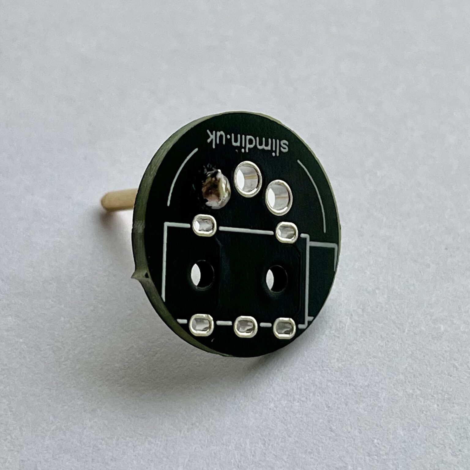 Applying heat and solder under pressure